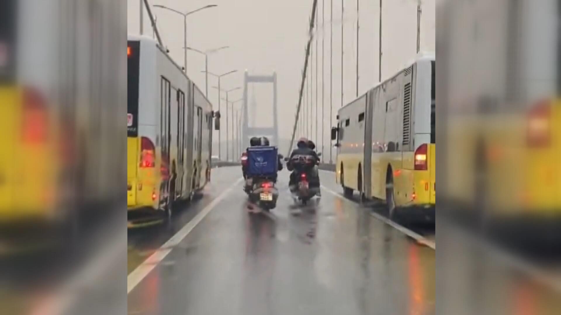 2 bus guards the 4 motorcycles on 15 Temmuz Sehitler Bridge