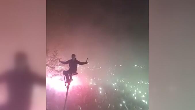 Fan celebrating the championship on the lighting pole: There was a magnificent view