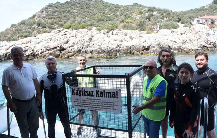 Waste container lowered under water in Antalya